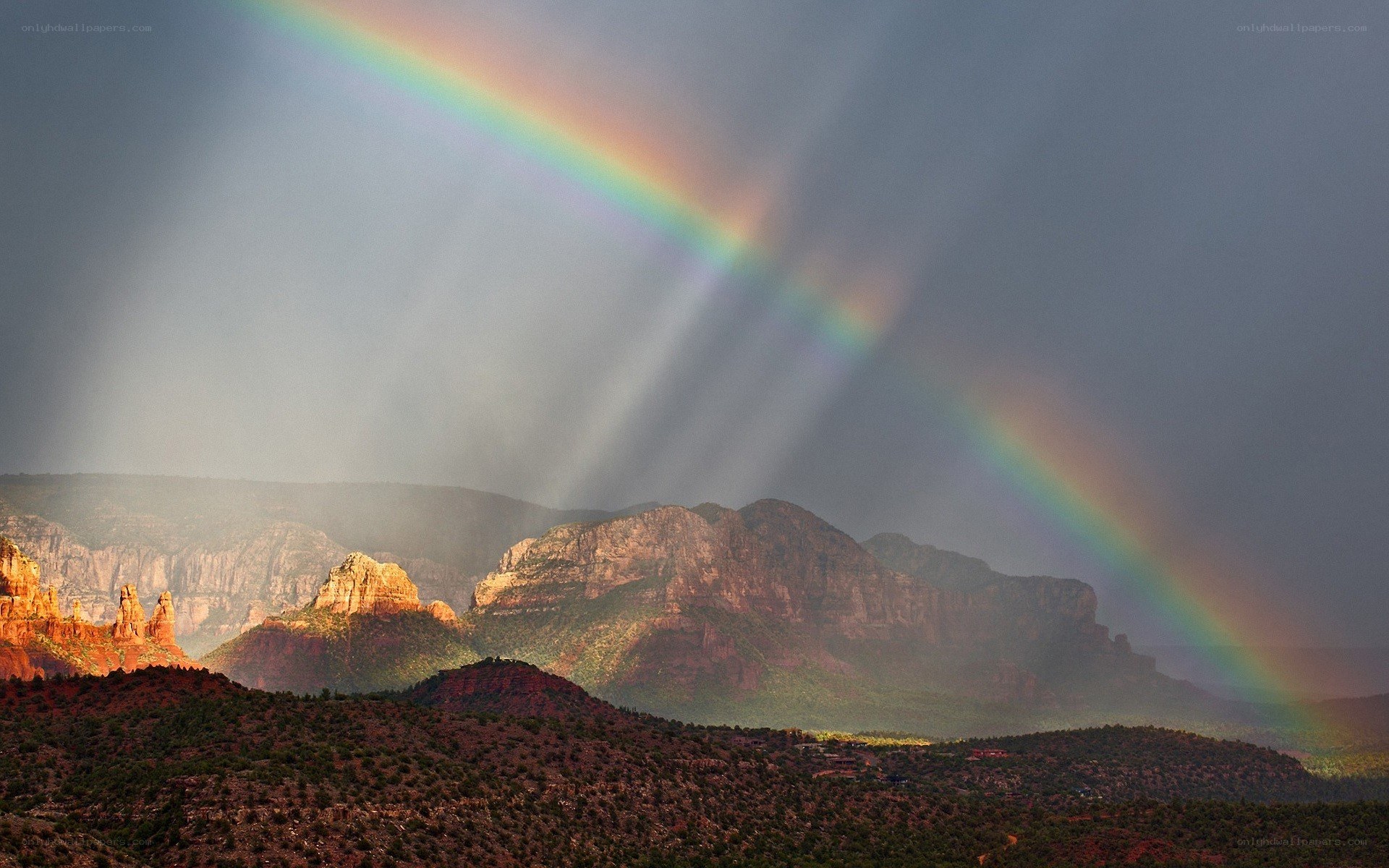 Rainbow over red rock formations