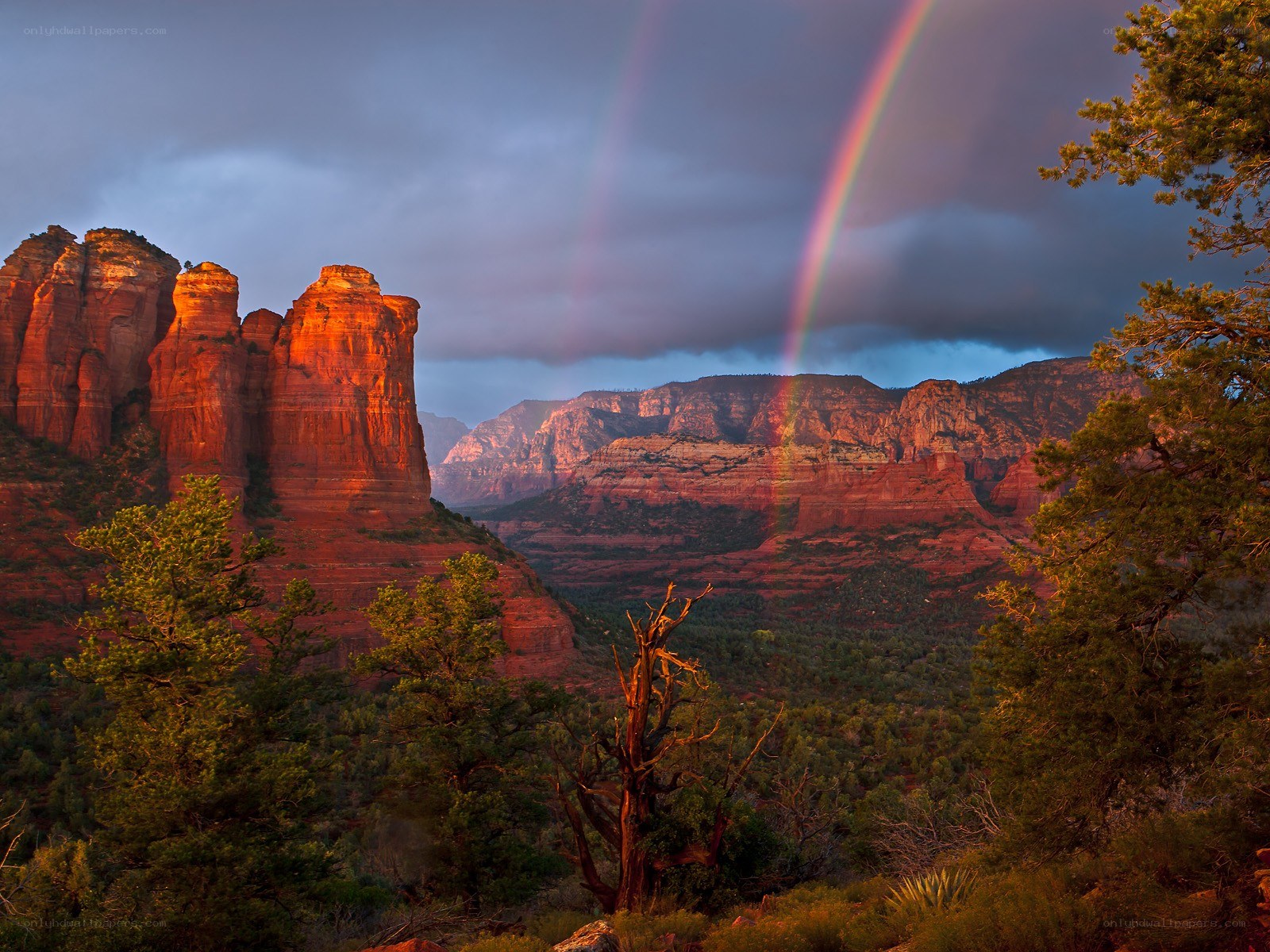 Rainbow over red rock formations