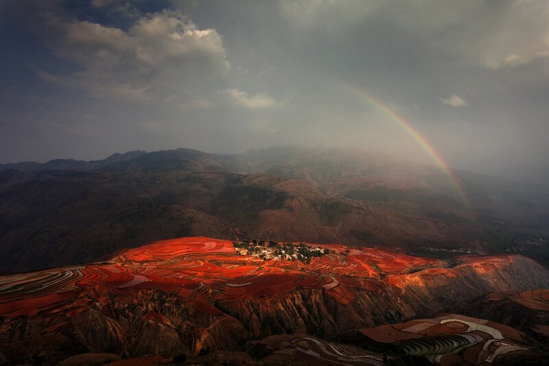 Rainbow over red terraces