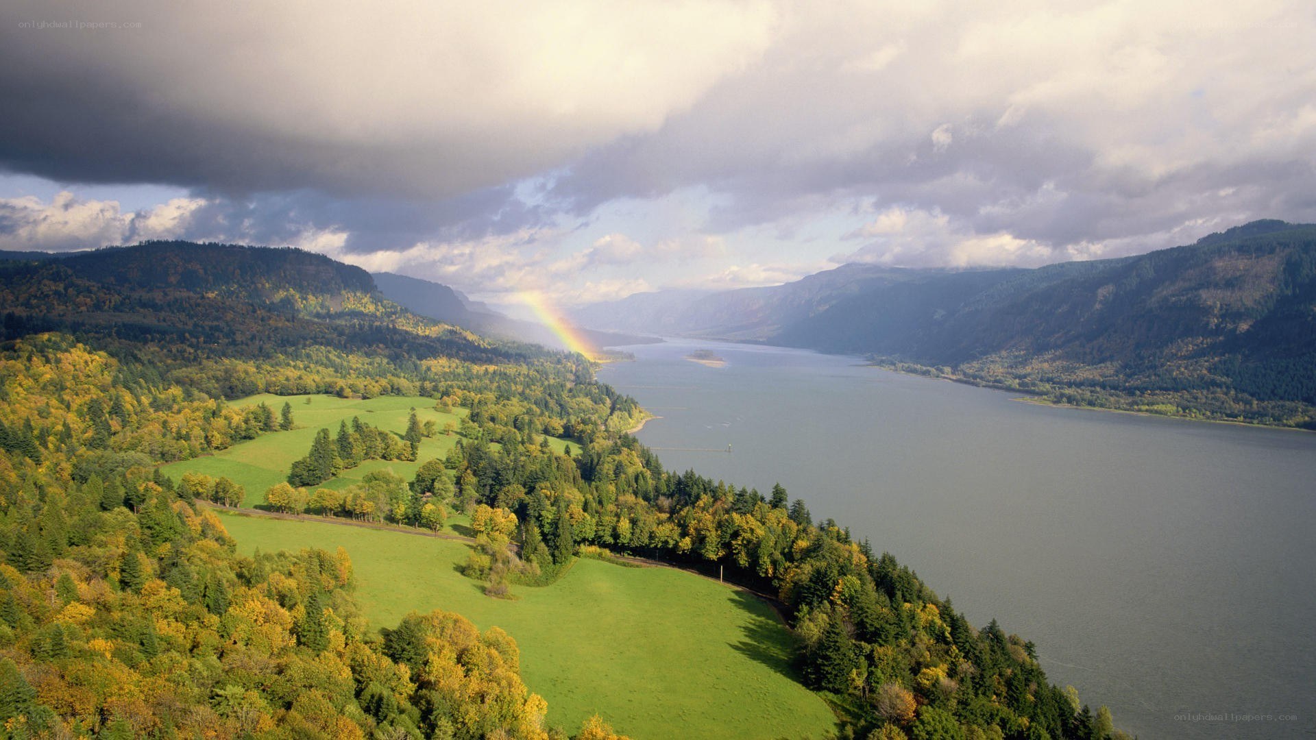 Rainbow over river valley