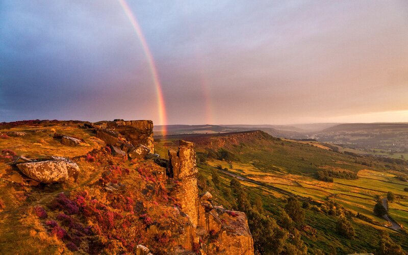 Rainbow over rocky cliffs