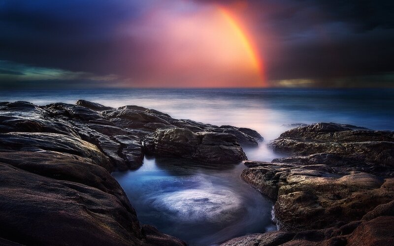 Rainbow over Rocky Shore — Blue, Dramatic, Sunset, Photograph