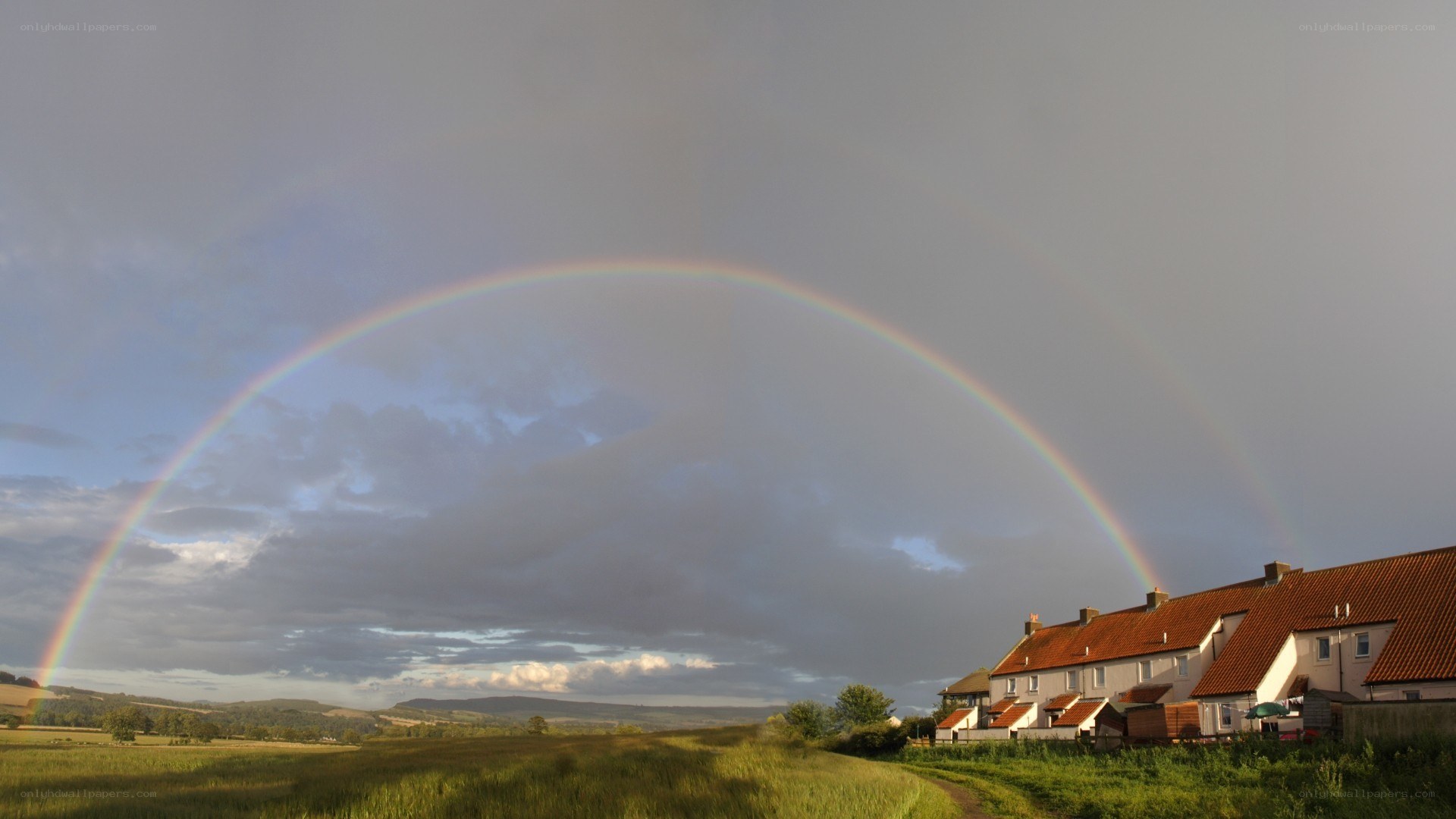 Rainbow over rural village