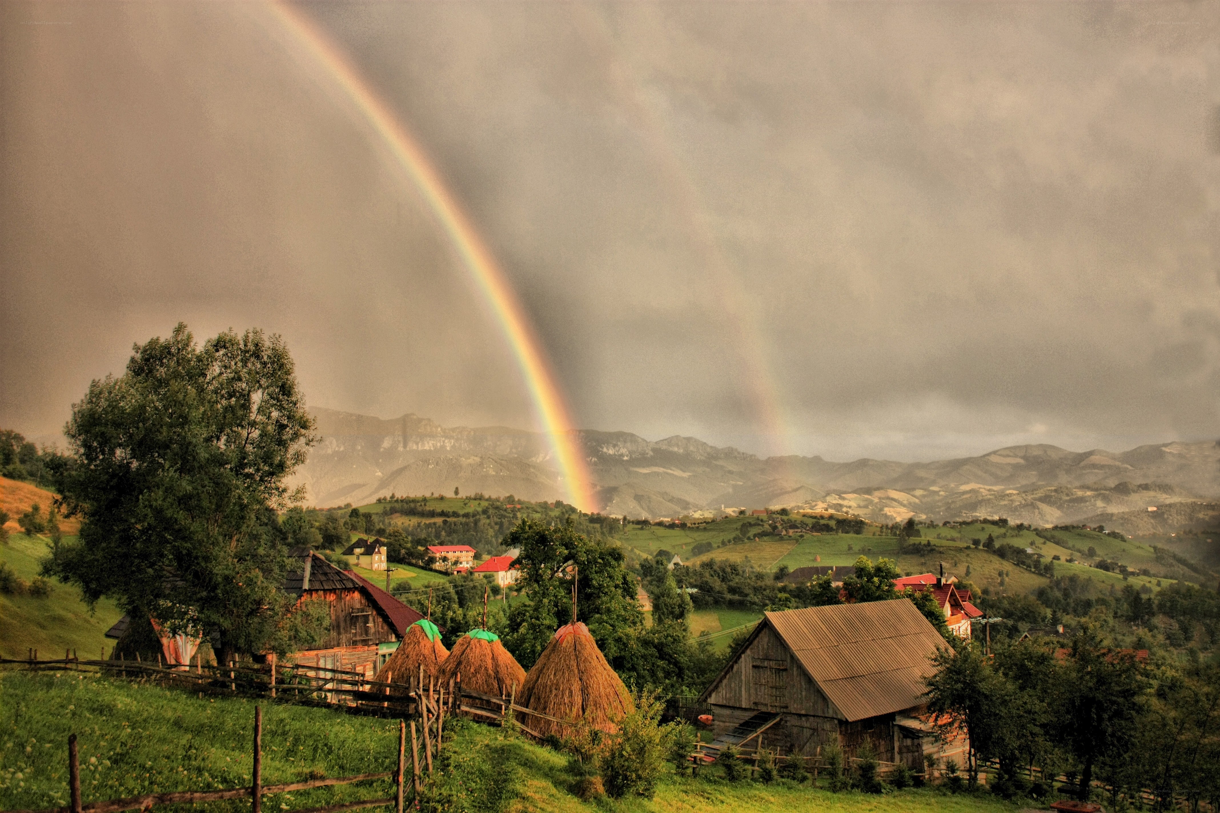 Rainbow over rural village