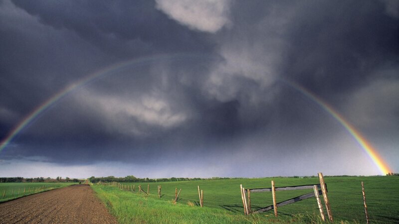 Rainbow over stormy fields