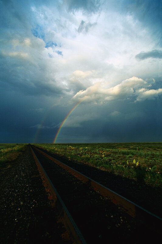 Rainbow over train tracks
