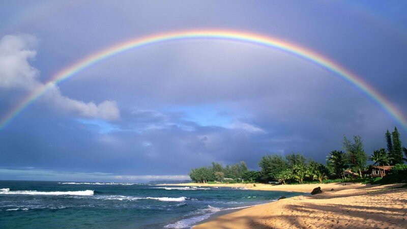 Rainbow over tropical beach