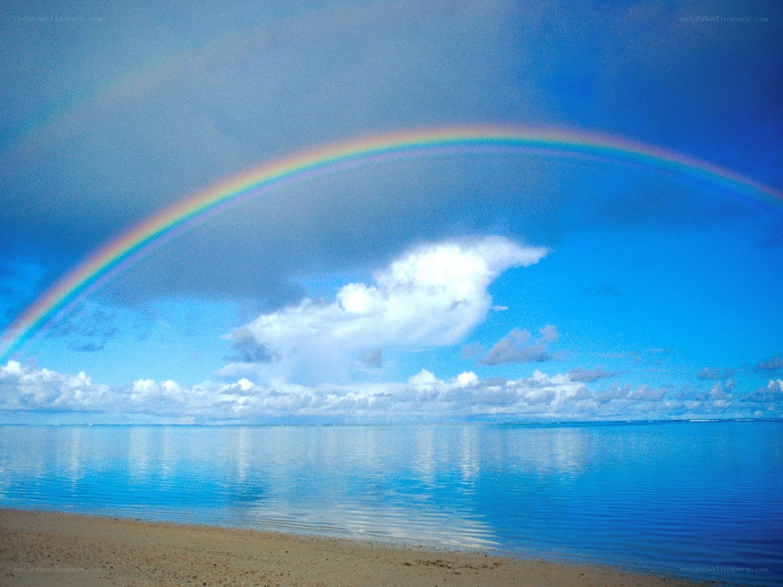 Rainbow over tropical beach