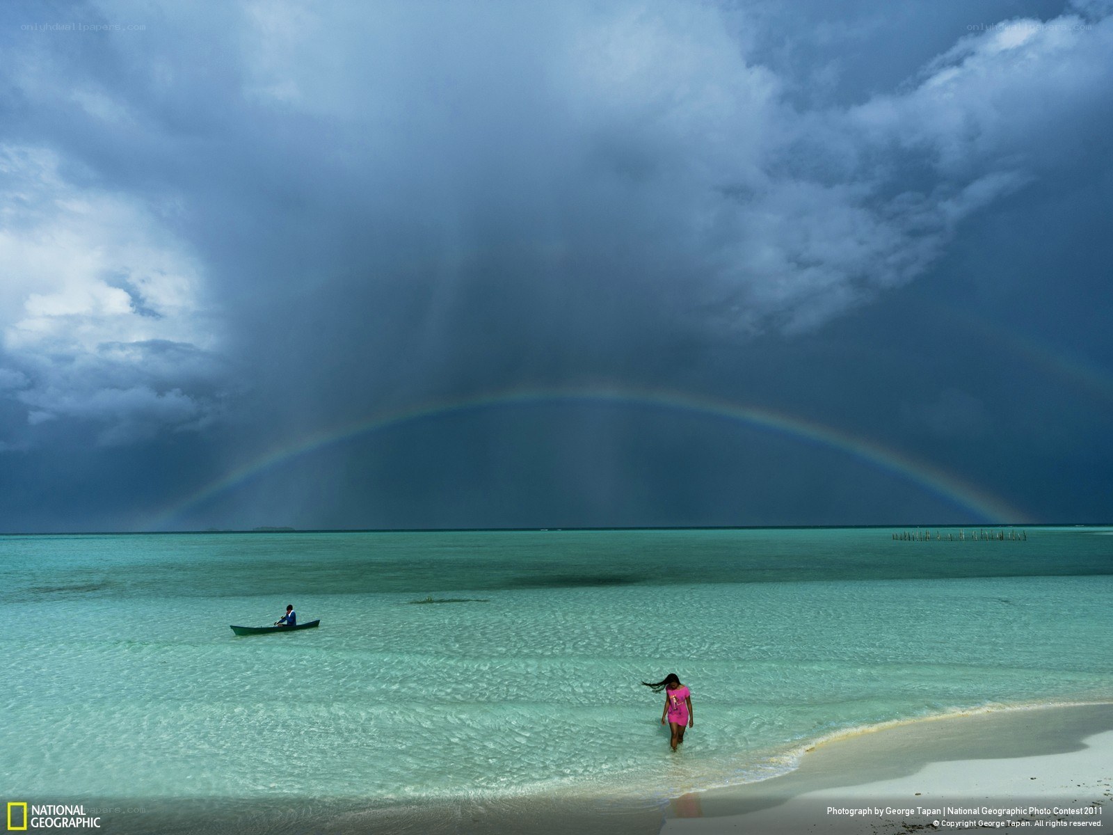 Rainbow over tropical beach