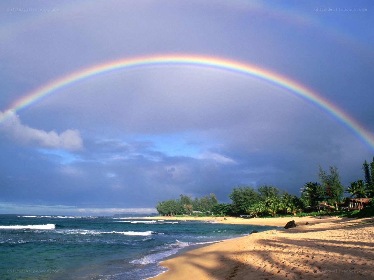 Rainbow over tropical beach