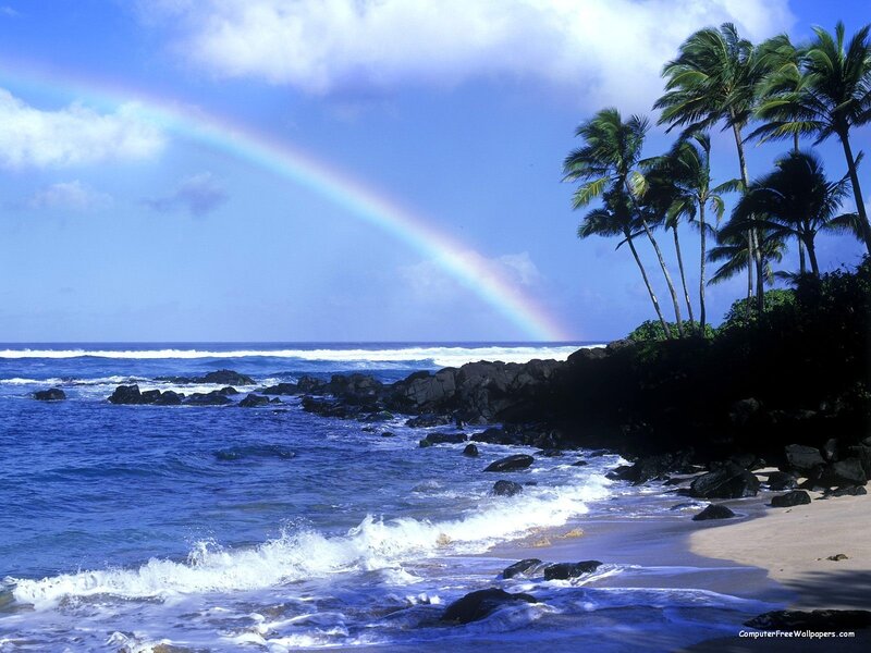 rainbow over tropical beach