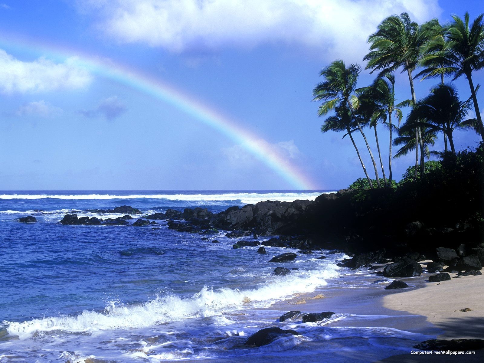 rainbow over tropical beach