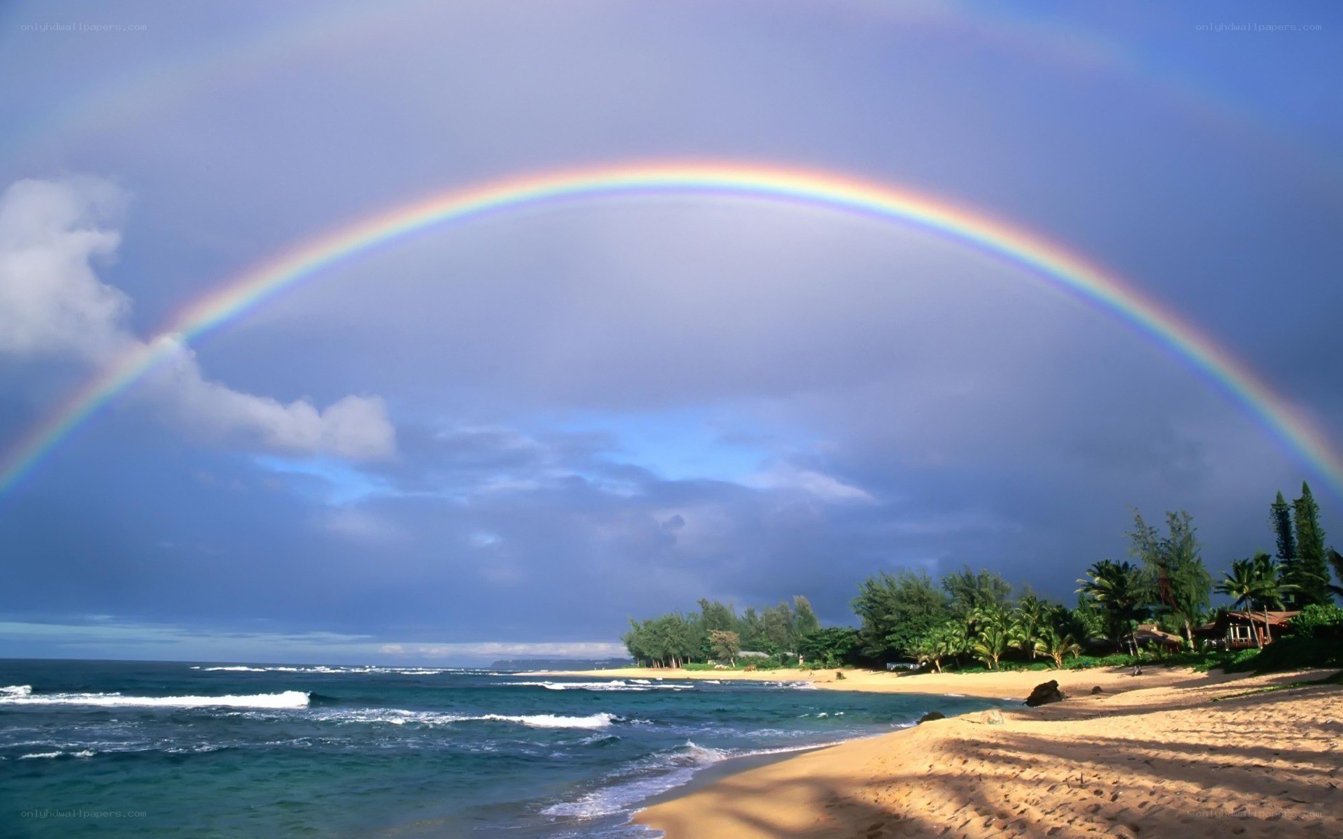 Rainbow over tropical beach