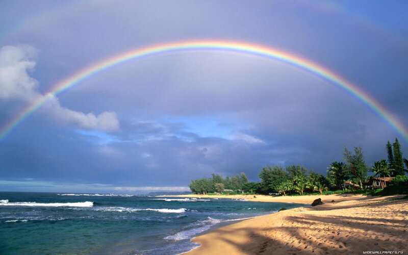 Rainbow over tropical beach