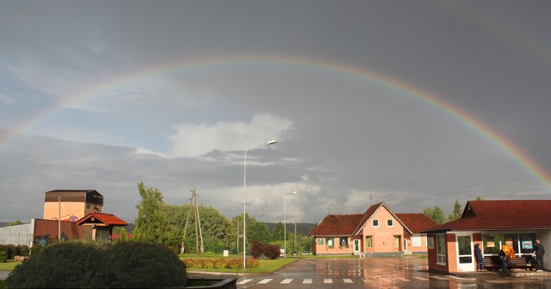 Rainbow over Village — Gray, Dramatic