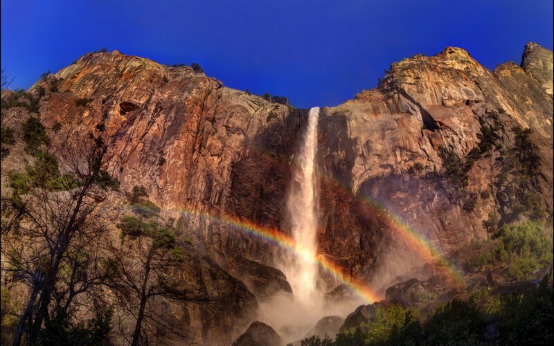 Rainbow over Waterfall — Blue, Dramatic, Afternoon, Photograph, Mountain