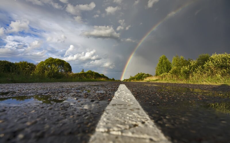 Rainbow over Wet Road — Dramatic