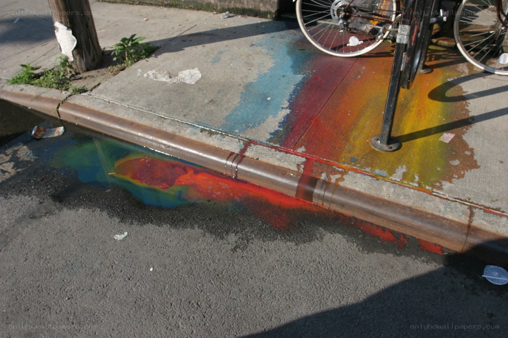 rainbow paint on sidewalk