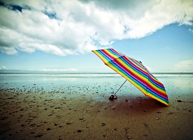 Rainbow Umbrella on Beach — Blue, Serene