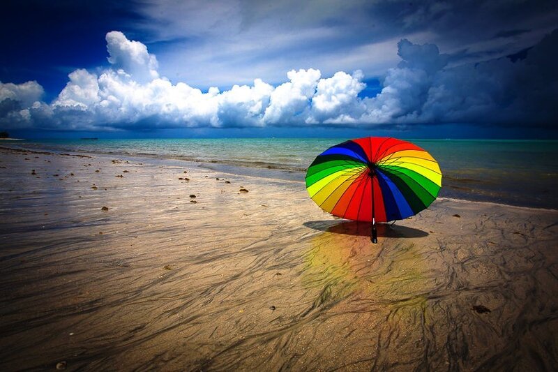 Rainbow Umbrella on Beach — Blue