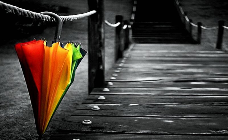 Rainbow Umbrella on Dock