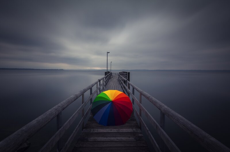 Rainbow Umbrella on Pier