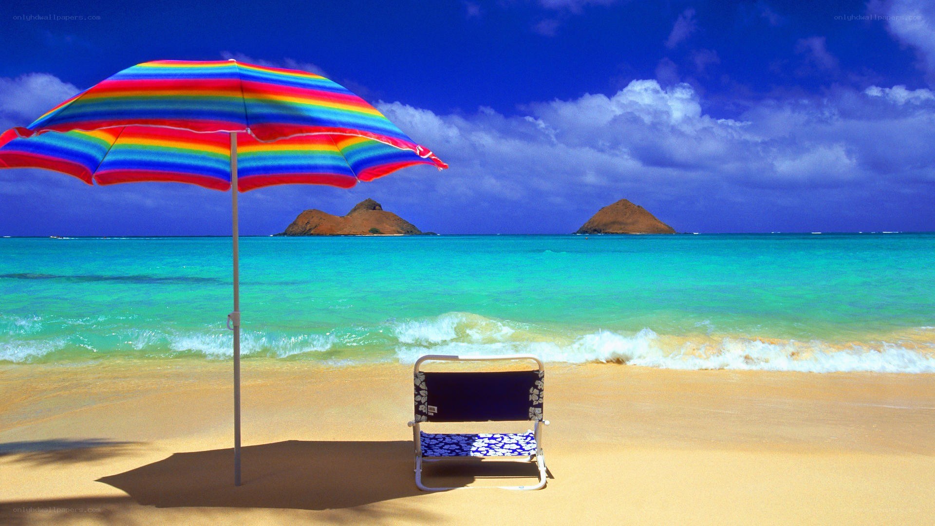 Rainbow umbrella on tropical beach