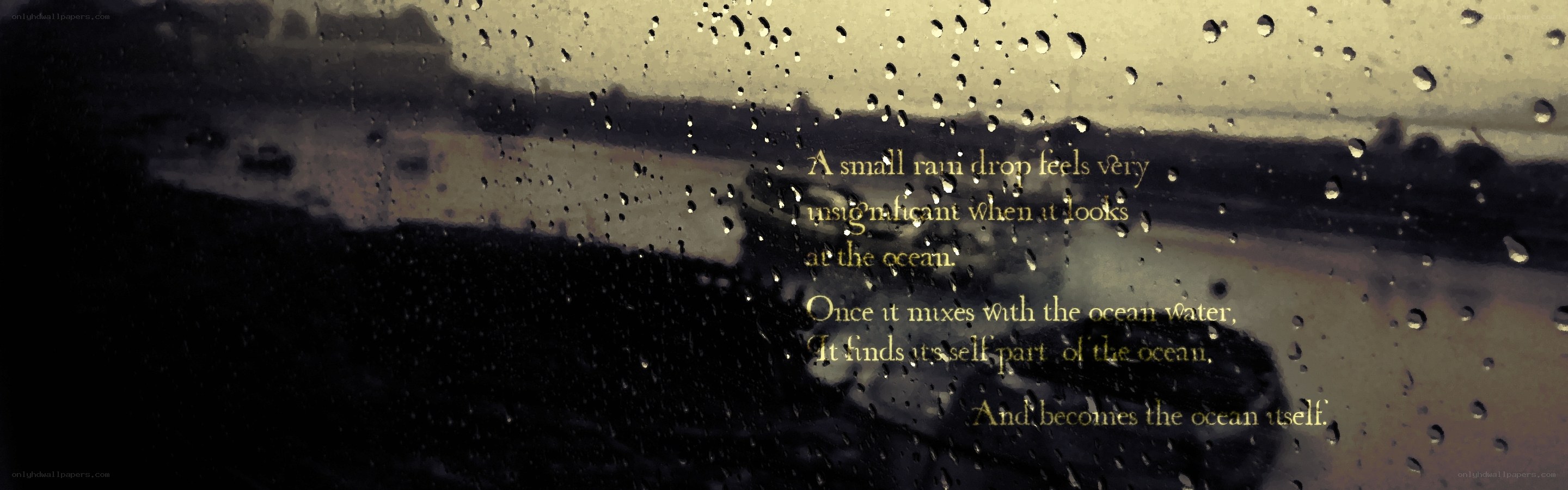 raindrop on window with quote