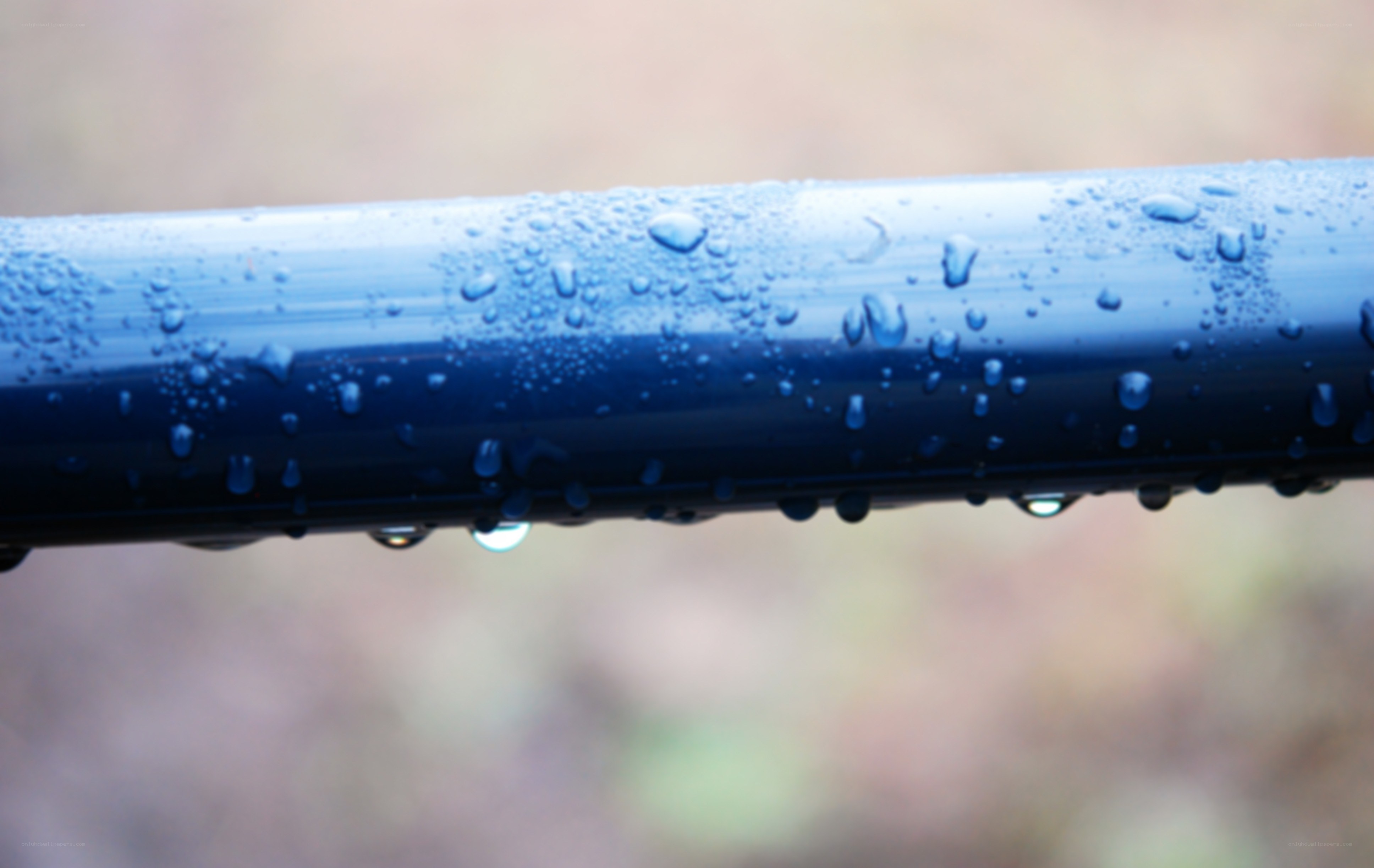 raindrops on a blue pipe
