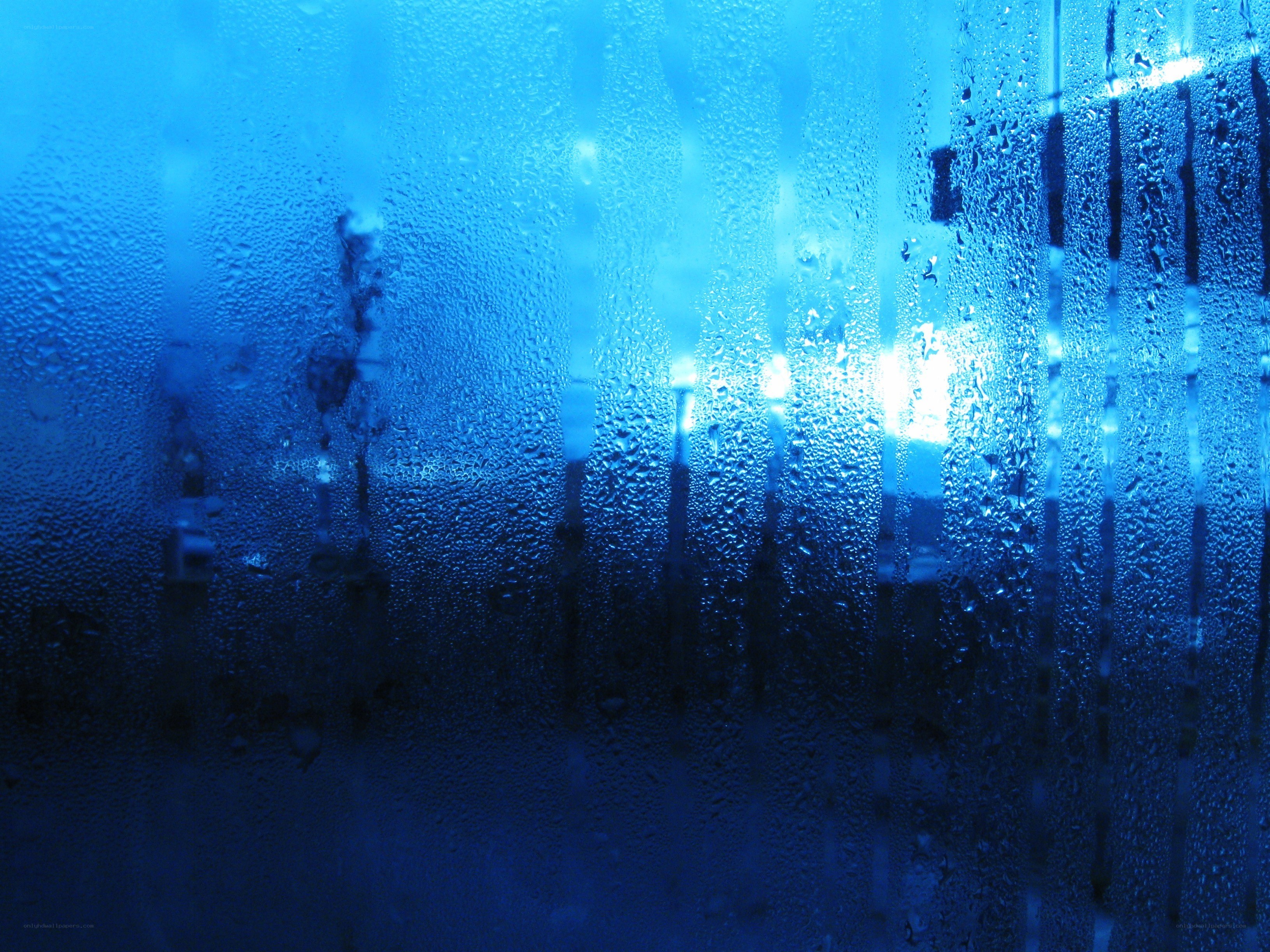 Raindrops on a blue window