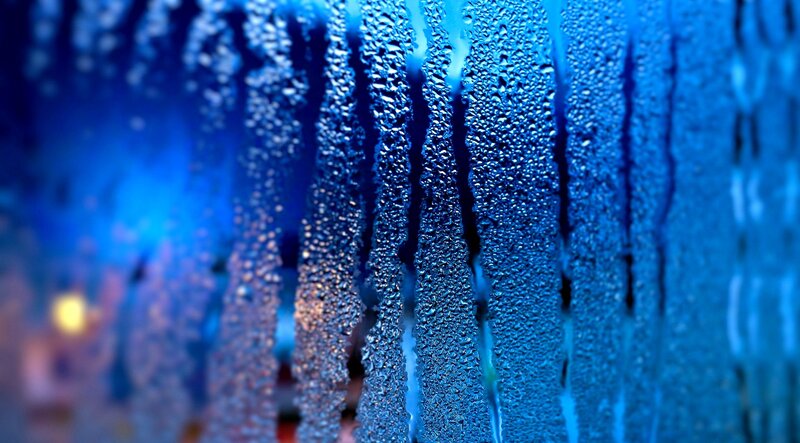 Raindrops on a blue window
