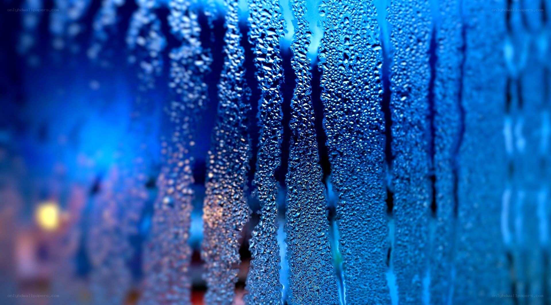 Raindrops on a blue window