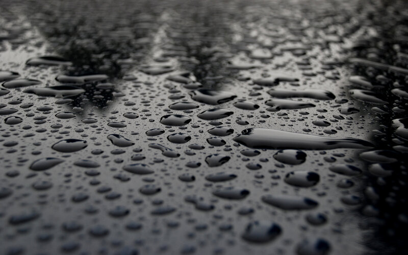 raindrops on a dark surface