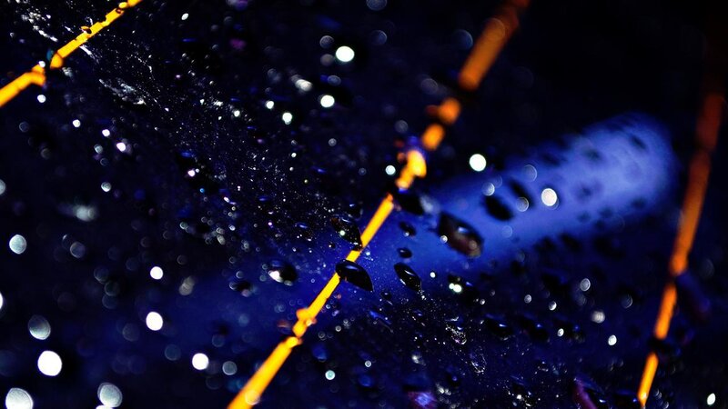 raindrops on a dark surface