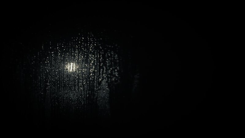 raindrops on a dark window
