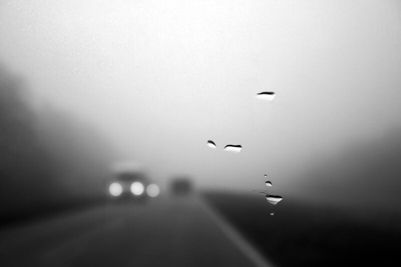 Raindrops on a foggy road