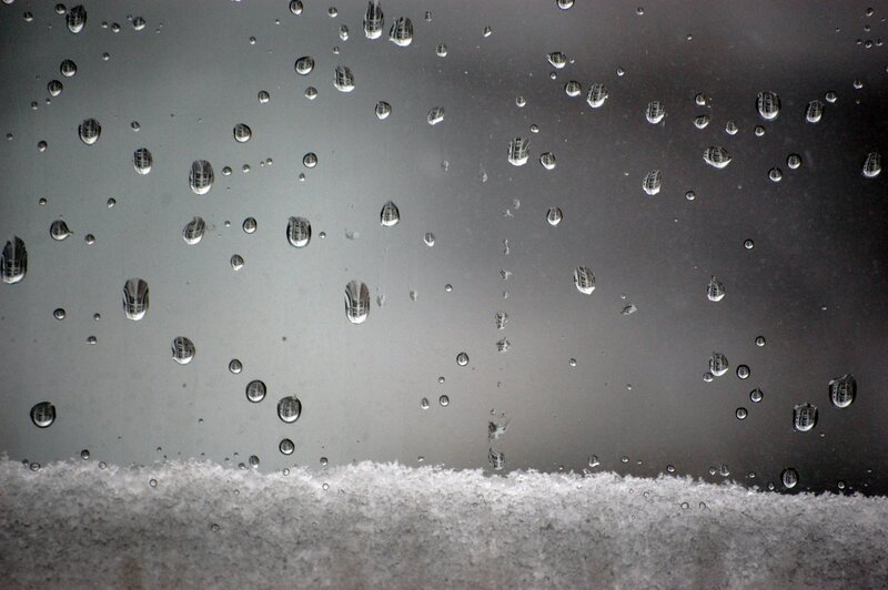 Raindrops on a snowy window