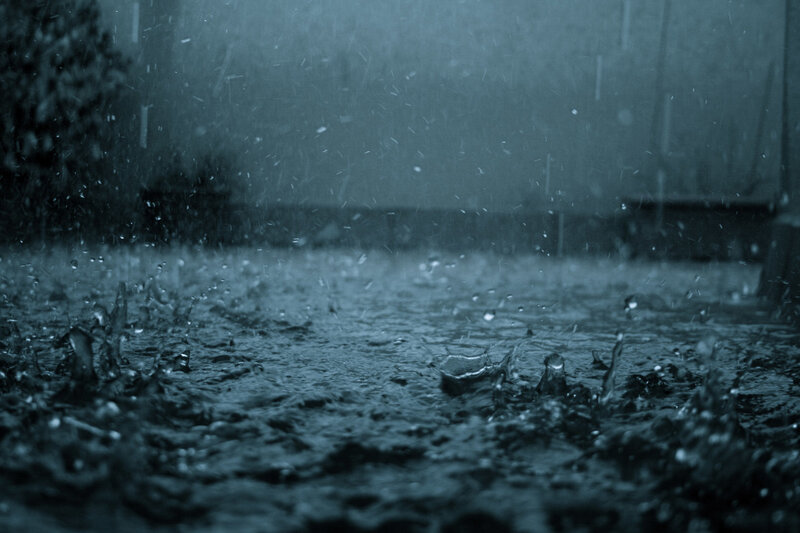 Raindrops on a wet surface