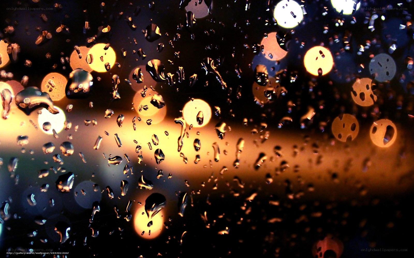 Raindrops on a window at night