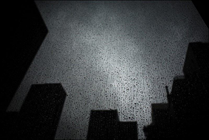 Raindrops on a window at night