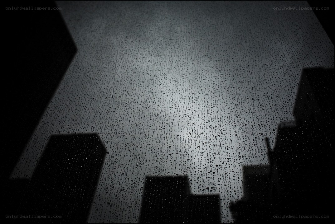 Raindrops on a window at night