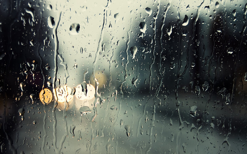 Raindrops on a window at night