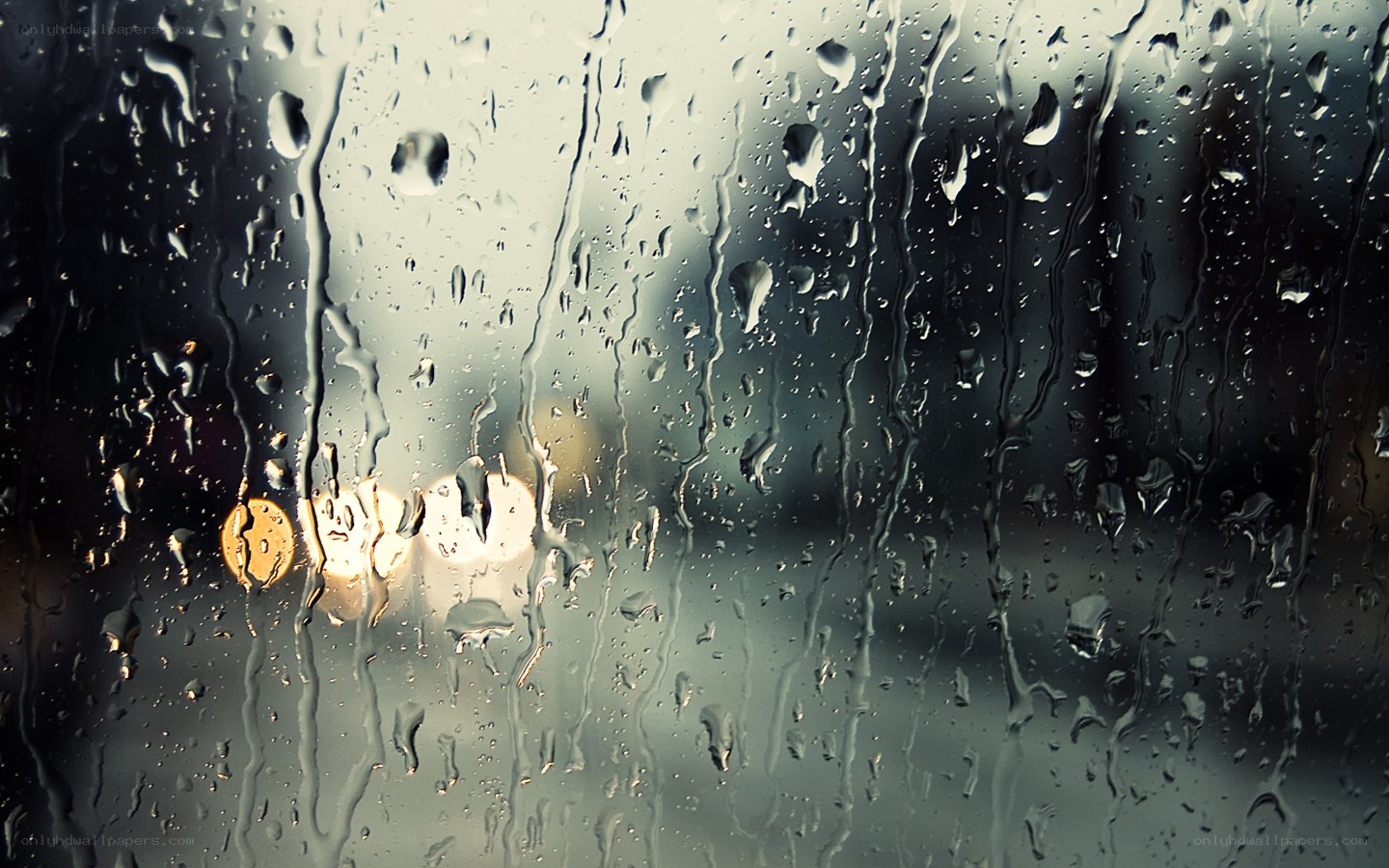 Raindrops on a window at night