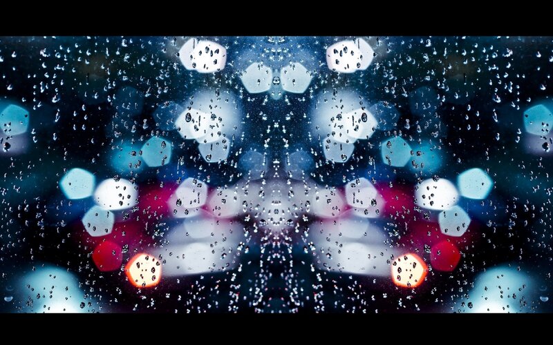 Raindrops on a window at night