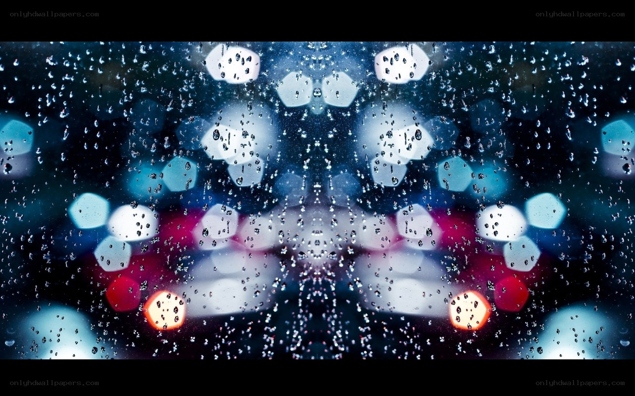 Raindrops on a window at night