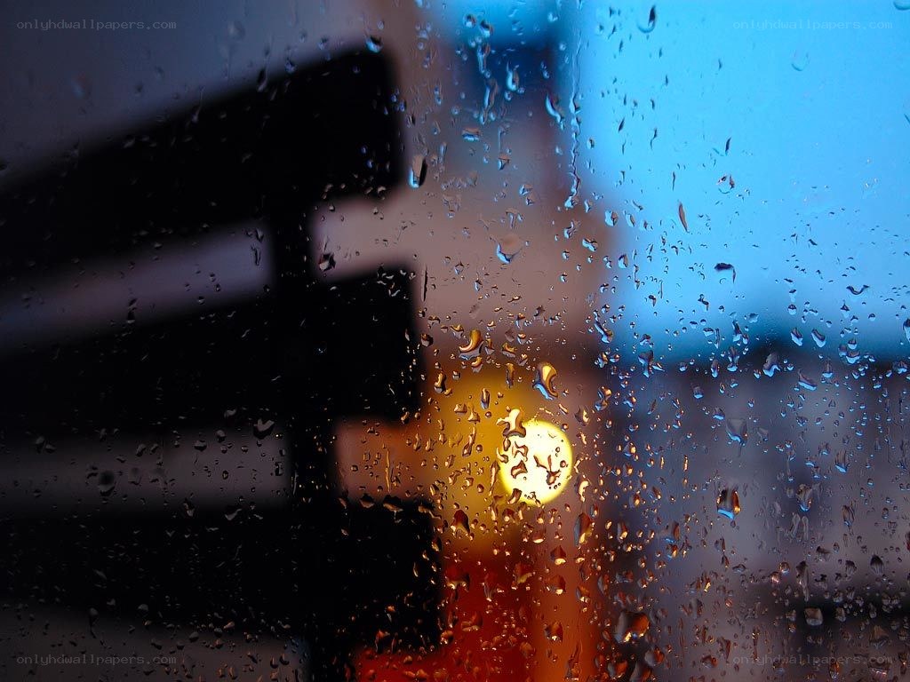 Raindrops on a window at night