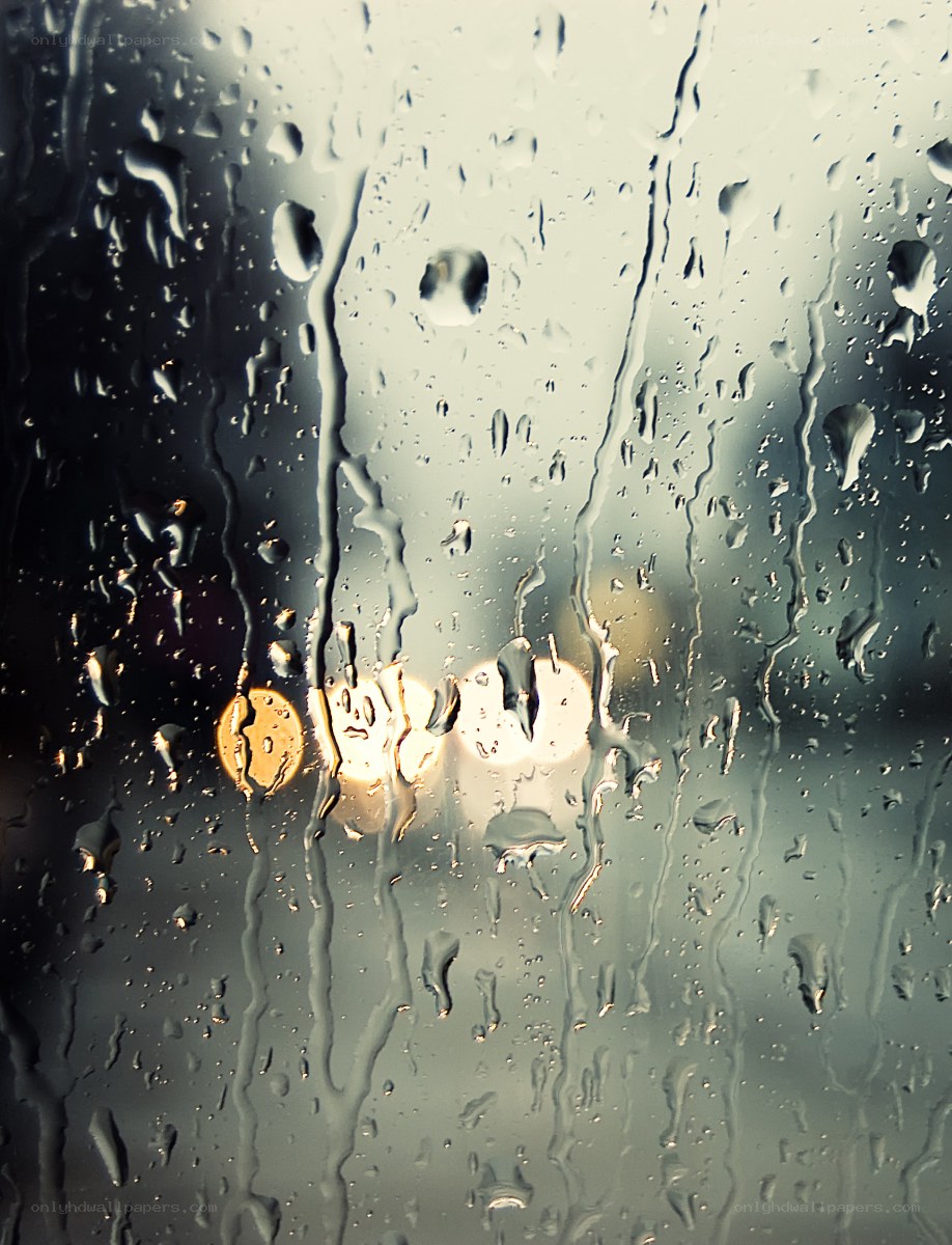 Raindrops on a window at night