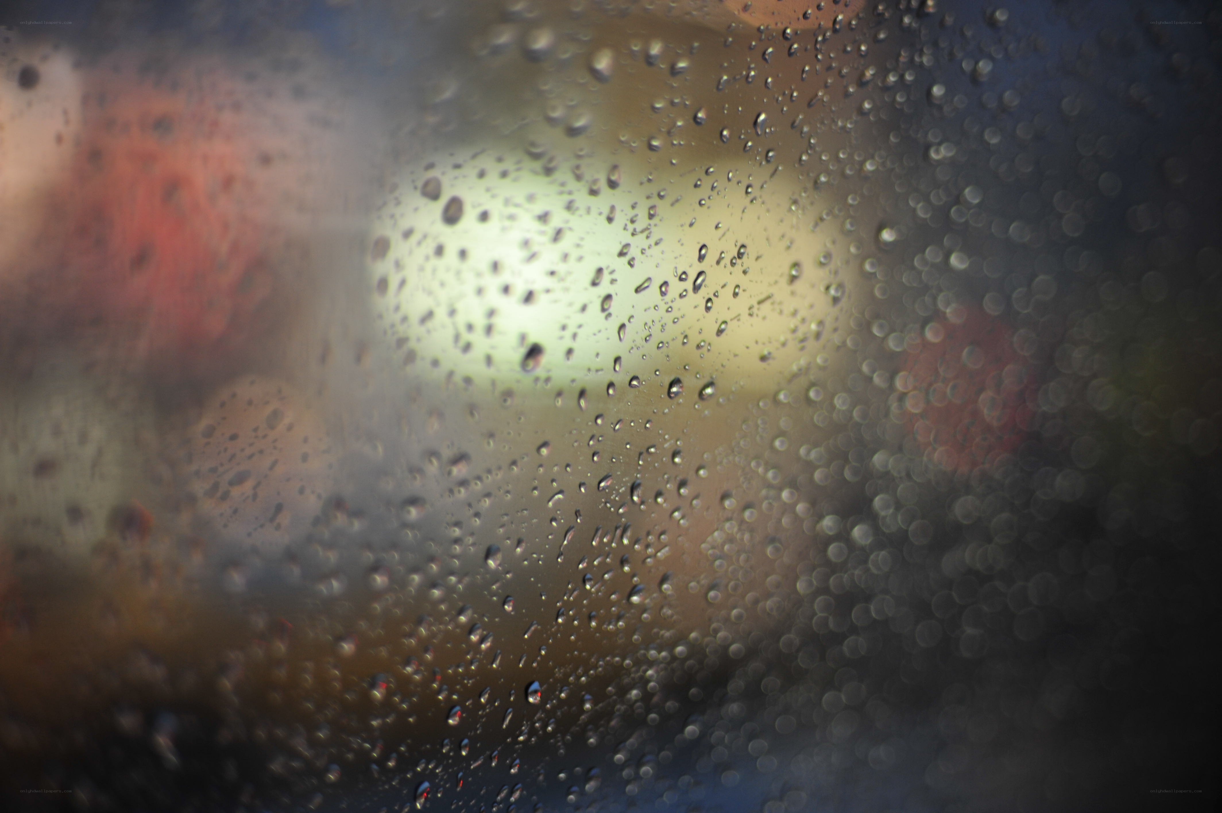 raindrops on a window at night