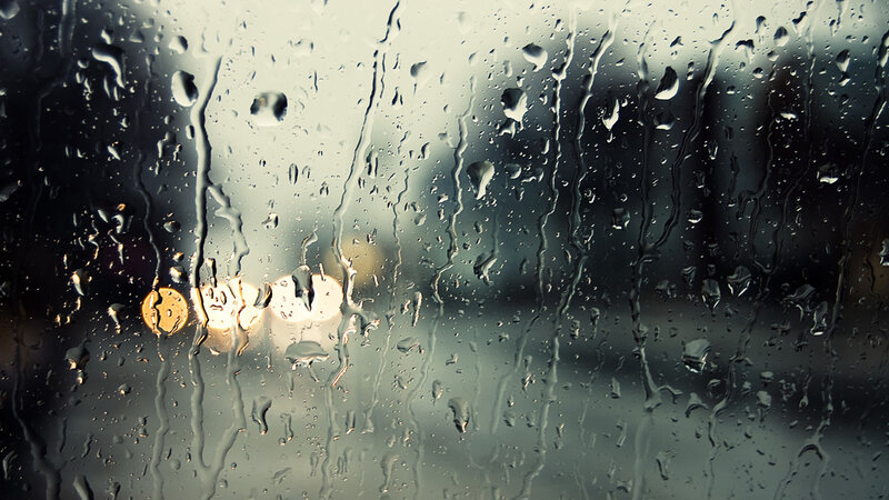 Raindrops on a window at night
