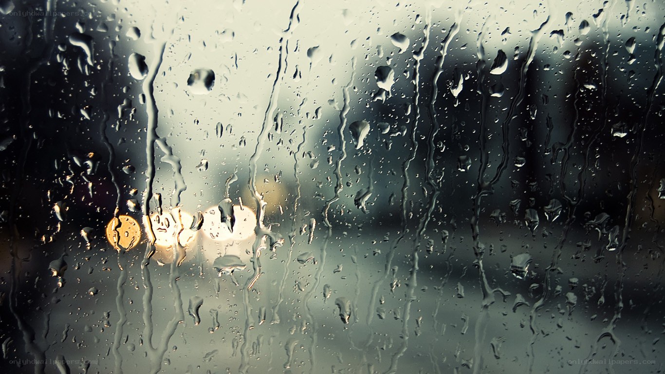 Raindrops on a window at night